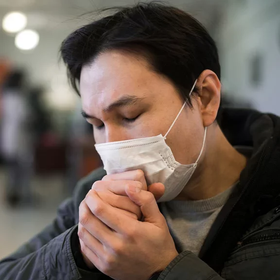 A man suffering from COPD is coughing
