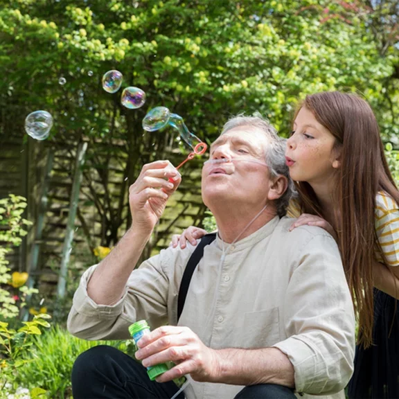 COPD patient playing with his granddaughter